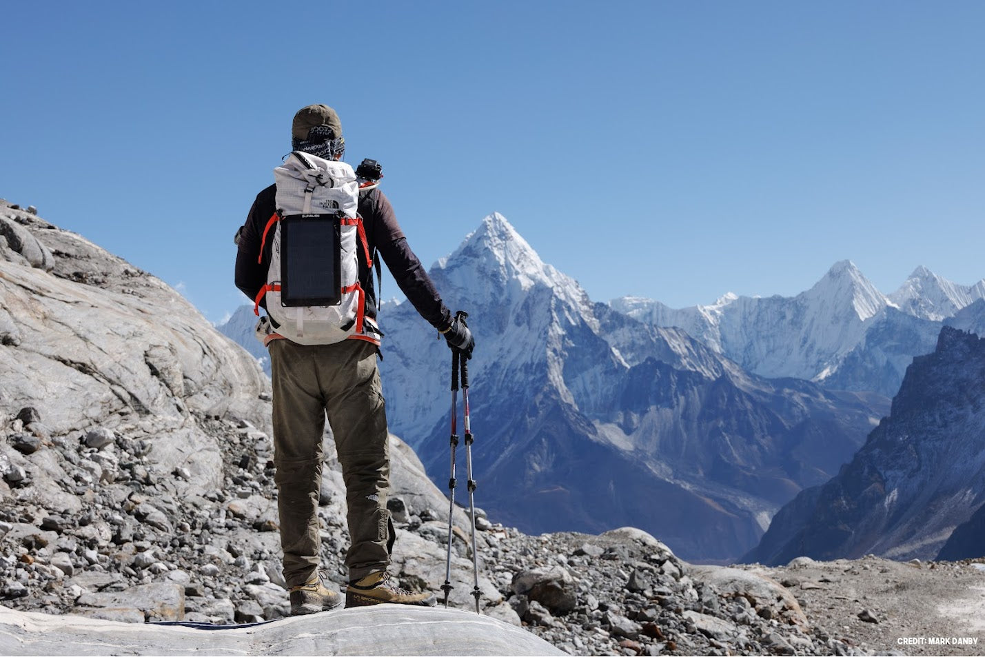 Fusion flex 6 ( portable solar panel ) on the back of a mountain climber