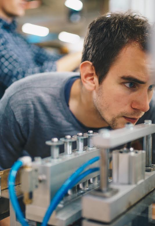 Sunslice co-founder Henri Gernaey working on a solar panel production machine