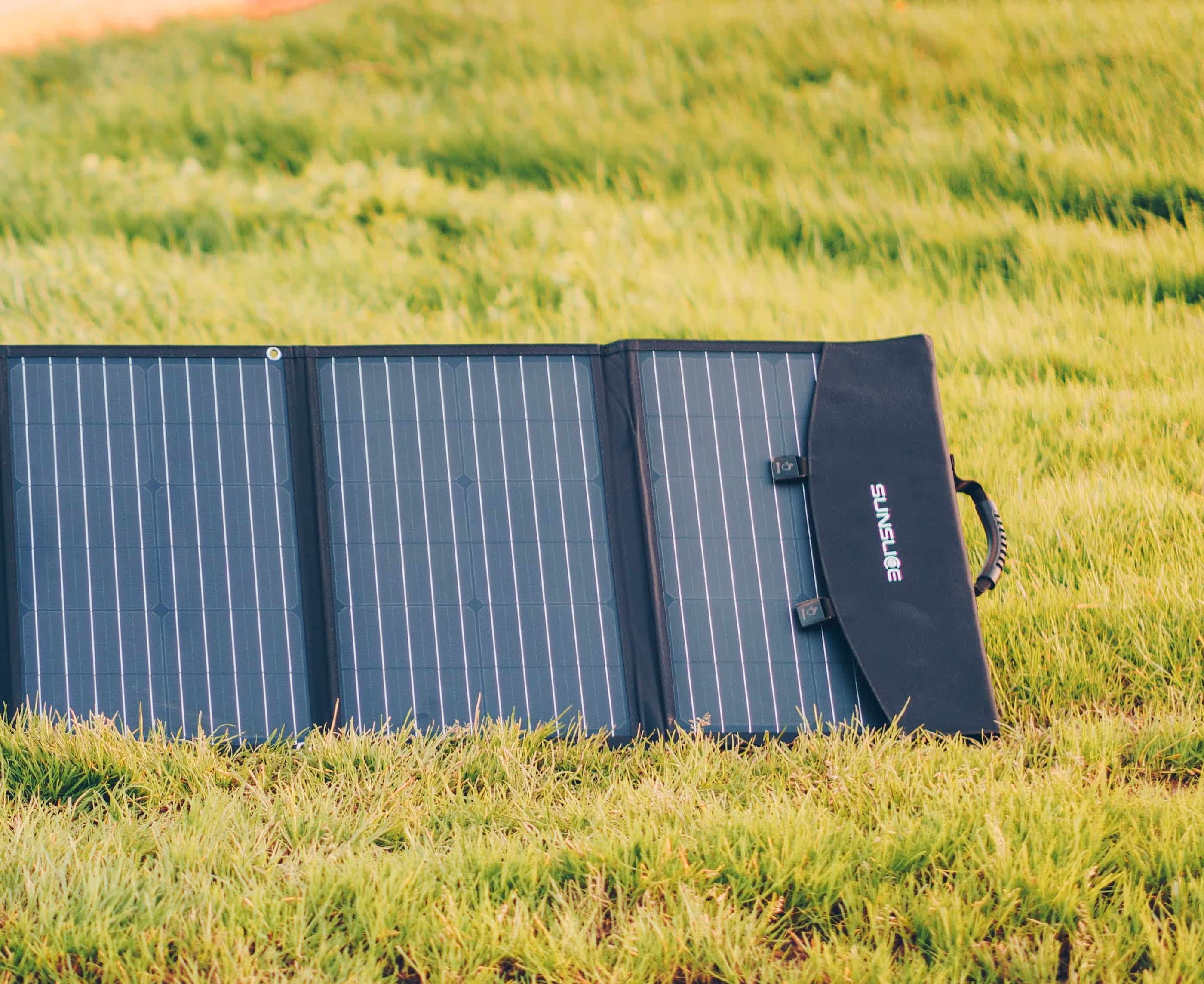 the best portable solar panel on a green sunny surface