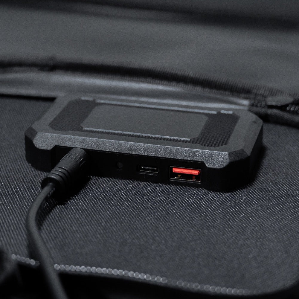 zoom in on the USB ports of a foldable solar panel with specifications