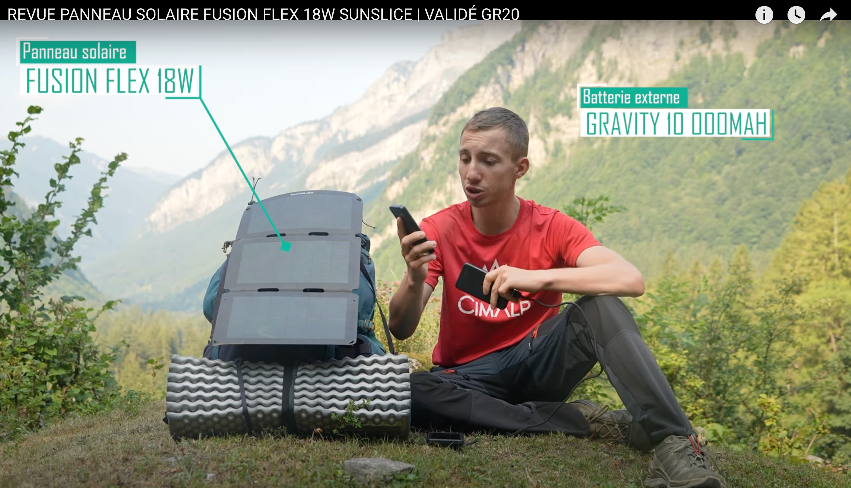 a camper on a mountaintop presenting a portable solar panel for camping with a power bank 50000mah