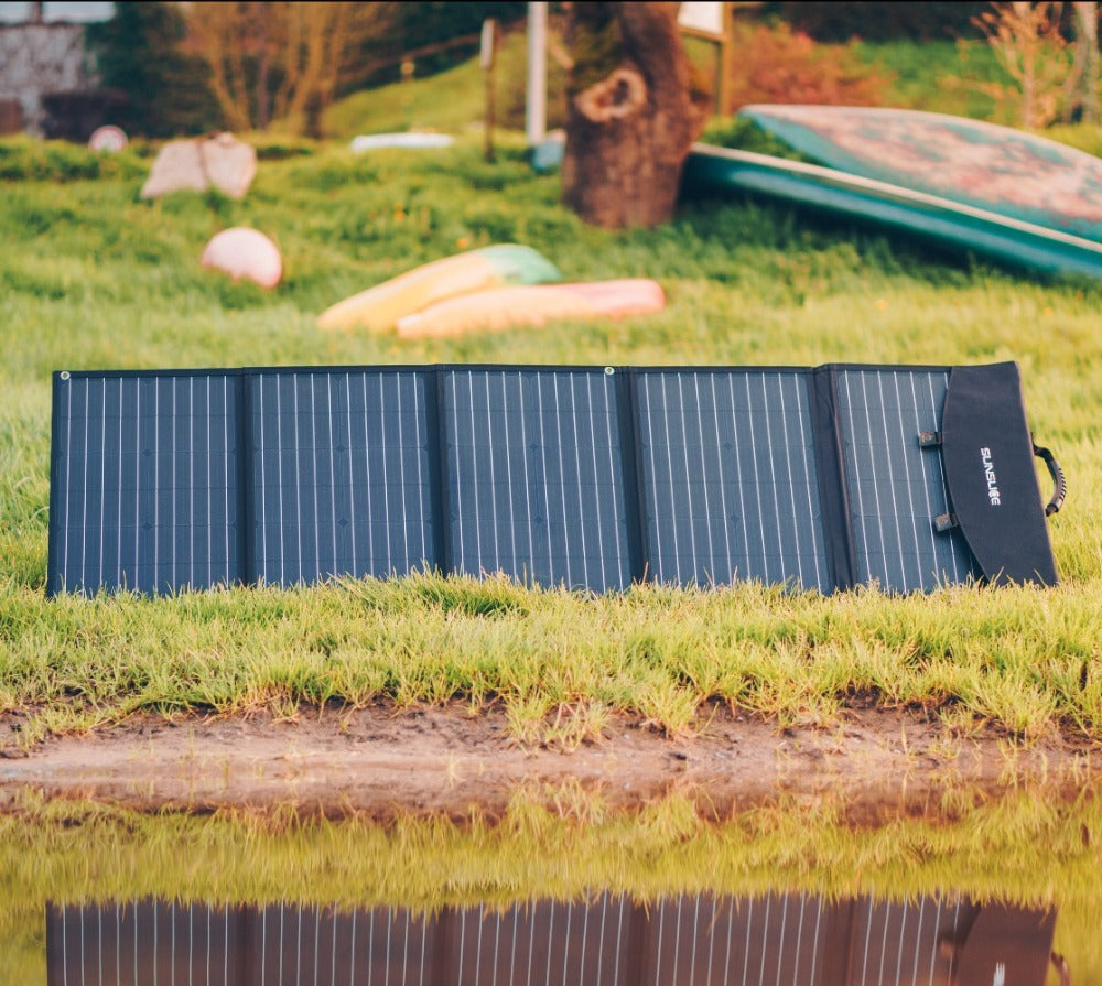 Fusion 150 Watts - the best portable solar panel on a green sunny surface